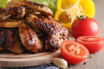 Chicken wings barbecue with different vegetables