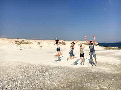 Family jumping all together on vacation