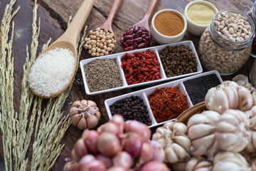 Cereal grains , seeds, beans,spices on wooden background.