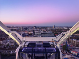 Skyline of Munich on a Ferris wheel at sunset