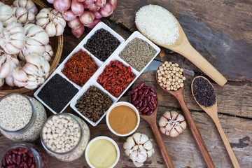 Cereal grains , seeds, beans,spices on wooden background.
