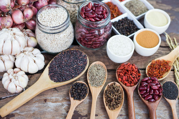 Cereal grains , seeds, beans,spices on wooden background.