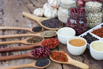 Cereal grains , seeds, beans,spices on wooden background.