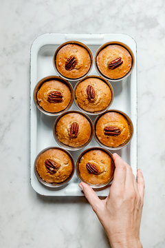 Woman hands holding Pecan Muffins