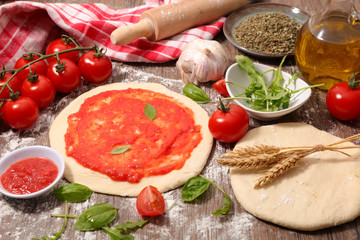 pizza dough with tomato sauce