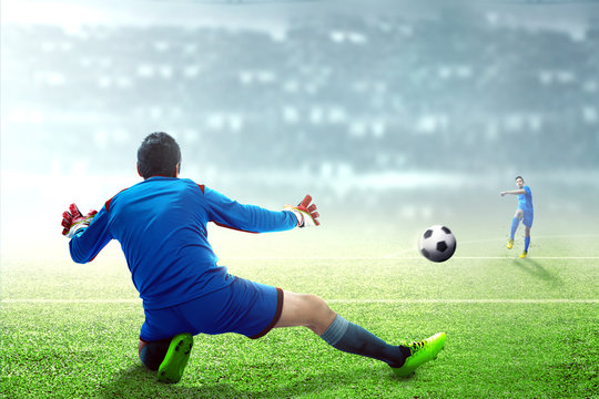 Asian Football Player Man Kicking The Ball To The Goal