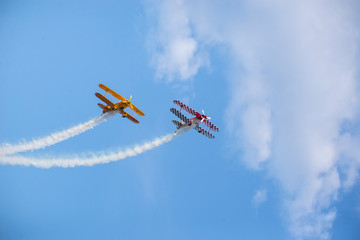 Fototapeta na wymiar Airplanes in the sky with smoke trails 