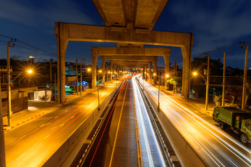 Fototapeta na wymiar High view of blur light car traffic at the tunnel junction