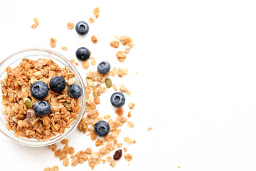 Crunchy muesli and blueberry Breakfast cereals isolated on white background, selective focus, top view