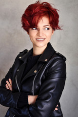 Portrait of a beautiful young red-haired woman with short hair