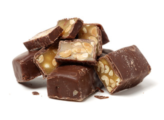 Chocolate peanut candy on white background