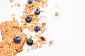 Crispy muesli cookies and blueberry Breakfast cereals isolated on white background, selective focus, top view