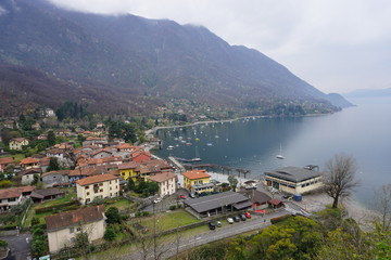 Obraz premium bird eye view of a small village by the shore of lake Lugano, Italy