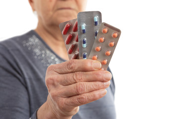 Closeup of pills held by patient