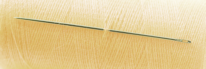 Yellow threat with needle