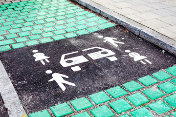 Car sharing vehicle parking sign on asphalt road