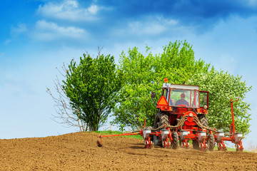 Tractor with mounted crop seeder