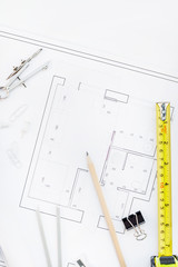 Interior designer table workplace with house plan