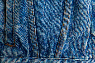 Fototapeta premium classic grunge background: real old american denim, close, scar and thread, short focus, top view