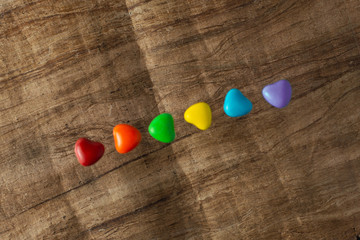 LGBT sweet flag: rainbow colored caramels lie in a row