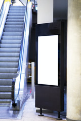 Mock up of light box beside escalator for advertising material