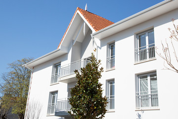 real building new exterior estate with light blue sky