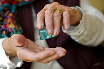 senior woman taking medication