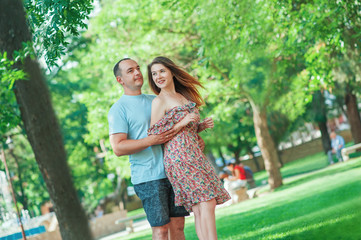 Fototapeta premium Romantic couple man and woman lovers in fashion clothes having date outdoor in park. Relationship Love Emotions Lifestyle People Fashion Country streetsty Family