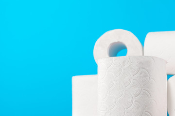 Toilet paper stack on bright blue background