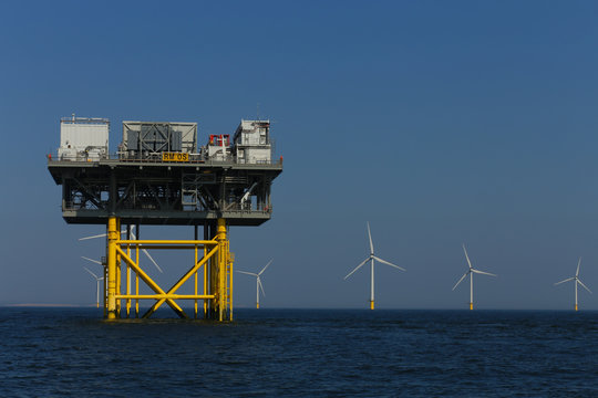 view of the offshore platform and windmills of Rampion windfarm off the coast of Brighton, Sussex, UK