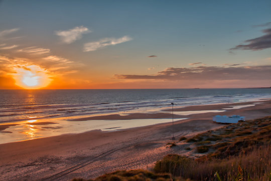 Sunset at the beach of La Barrosa, in Chiclana de la Frontera, a tourist town on the coast of the province of Cadiz, southern Spain