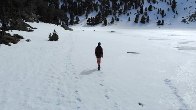 Man sets off into the wilderness alone, practicing cold conditioning mediation in frozen environment