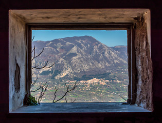 Looking out a Window in an Abandoned Medieval Village in Southern Italy
