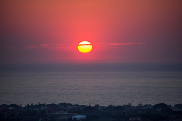 Obraz premium Red Sunset over the Southern Mediterranean Sea in southern Italy