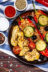Pepper stuffed with groats and vegetables and grilled chicken strips