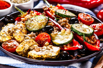 Pepper stuffed with groats and vegetables and grilled chicken strips