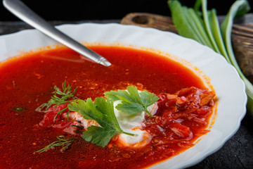 Vegetable soup with beets, rustic style, selective focus