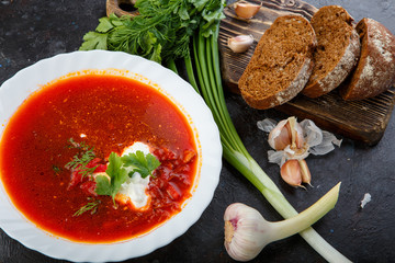 Vegetable soup with beets, rustic style, selective focus.