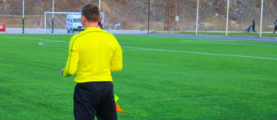 FOOTBALL REFEREE WITH FLAG 