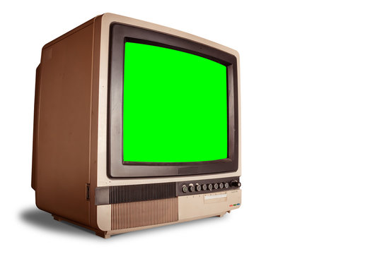 side view of old retro home TV receiver with blank green screen isolated on white background with clipping path