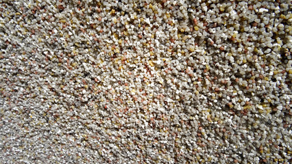 Wandstruktur verputzt kleine Steine