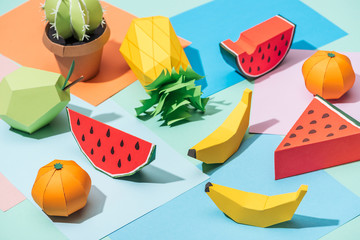 handmade cardboard fruits and cactus on multicolored paper