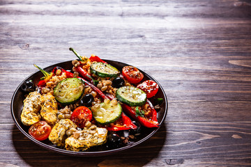 Pepper stuffed with groats and vegetables and grilled chicken strips