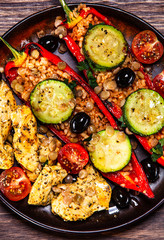 Pepper stuffed with groats and vegetables and grilled chicken strips