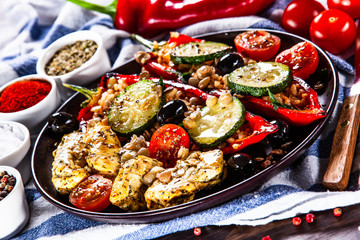 Pepper stuffed with groats and vegetables and grilled chicken strips
