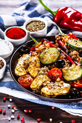 Pepper stuffed with groats and vegetables and grilled chicken strips