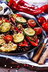 Pepper stuffed with groats and vegetables and grilled chicken strips