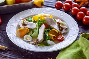 Salad of turkey with greens cheese and tomato and french mustard.