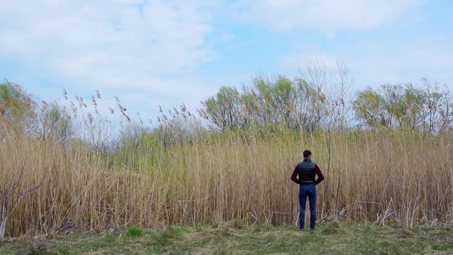 Guy Peeing In Park, Young Man Urinating Near Water, Human Influence On Ecology