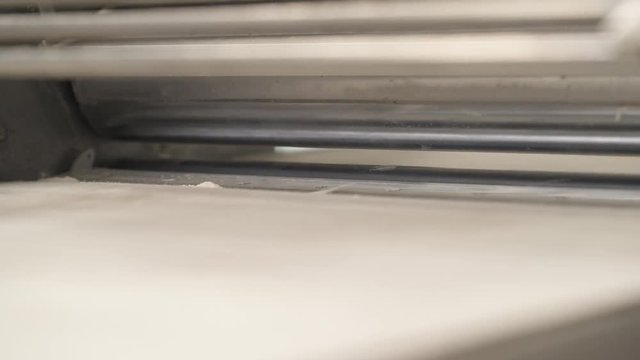 A close-up demonstration video of the working reversible countertop dough sheeter. Producing croissants at the bakery shop